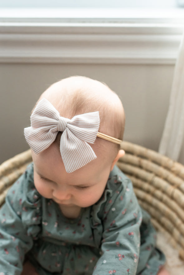 Nylon headband with stripped bow